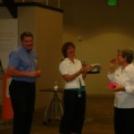 President Kipp & President-Elect Pickering Presenting a Gift to Sue Leister